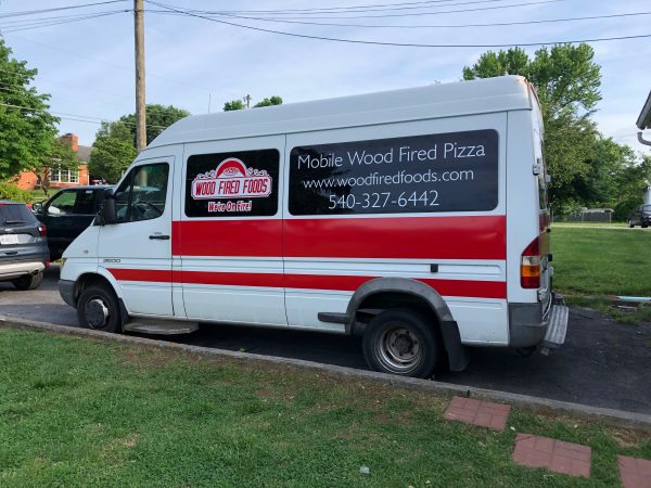 cut vinyl lettering and stripes on van